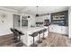 Bright, modern kitchen with a large island, sleek white cabinets, and stainless steel appliances, perfect for entertaining at Reunion Freunion F Mobile St, Commerce City, CO 80022