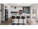 Stylish kitchen with a large island, bar seating, and a blue tiled backsplash at Reunion Freunion F Mobile St, Commerce City, CO 80022