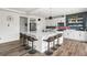 Modern kitchen island with seating, sleek appliances, and a stylish backsplash at Reunion Freunion F Mobile St, Commerce City, CO 80022
