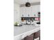 A pristine kitchen island features a modern faucet, pendant lighting, and sleek countertops for culinary creativity at Reunion Freunion F Mobile St, Commerce City, CO 80022