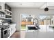 Spacious, updated kitchen flows seamlessly into backyard via sliding door, features spacious countertops and modern finishes at Reunion Freunion F Mobile St, Commerce City, CO 80022