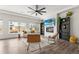 Bright living room with stylish furniture, fireplace, and decorative shelving at Reunion Freunion F Mobile St, Commerce City, CO 80022
