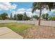 Large, grassy backyard enclosed by a white fence, creating a private outdoor space at 14791 E Security Pl, Aurora, CO 80011