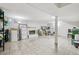 Spacious basement with white brick fireplace, tiled floor, and ample storage space at 14791 E Security Pl, Aurora, CO 80011