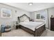 Spacious bedroom featuring ample natural light and unique headboard at 14791 E Security Pl, Aurora, CO 80011