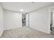 Clean empty bedroom with carpet and painted walls with an open door to storage at 14791 E Security Pl, Aurora, CO 80011