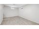 Empty bedroom with neutral walls and carpet with 2 windows and electrical outlets at 14791 E Security Pl, Aurora, CO 80011