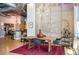 Bright dining room with hardwood floors, modern furniture, and exposed ductwork features an industrial aesthetic at 1720 Wazee St # 3B, Denver, CO 80202