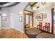 Hallway with hardwood floors, modern light fixtures, and stylish artwork at 1720 Wazee St # 3B, Denver, CO 80202
