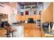 Gourmet kitchen features granite countertops, stainless steel appliances, and custom wood cabinetry at 1720 Wazee St # 3B, Denver, CO 80202