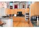 Modern kitchen boasts stainless steel appliances, stone countertops, and sleek wood cabinets at 1720 Wazee St # 3B, Denver, CO 80202