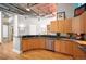 Bright kitchen features granite countertops, stainless steel appliances, and custom wood cabinetry at 1720 Wazee St # 3B, Denver, CO 80202