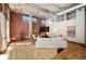 Stylish living room with exposed brick, hardwood floors, large windows, and comfortable seating at 1720 Wazee St # 3B, Denver, CO 80202