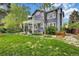Spacious backyard featuring a pergola-covered patio, lush lawn, and mature trees, perfect for outdoor living at 10882 Bullock Ct, Parker, CO 80134