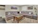 Finished basement with carpet, gray sectional, coffee table and wall art at 10882 Bullock Ct, Parker, CO 80134