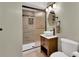 Stylish bathroom with tiled shower, vessel sink, and bronze fixtures at 10882 Bullock Ct, Parker, CO 80134