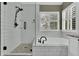 Modern bathroom with a glass shower, a soaking tub, and elegant fixtures at 10882 Bullock Ct, Parker, CO 80134