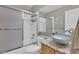 Bathroom with a large sliding glass door shower, a unique vessel sink, and modern fixtures at 10882 Bullock Ct, Parker, CO 80134