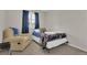 A comfortable bedroom featuring a lounger and a window, providing natural light at 10882 Bullock Ct, Parker, CO 80134