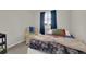 Inviting bedroom showcasing a lounger and natural light, creating a relaxed ambiance at 10882 Bullock Ct, Parker, CO 80134