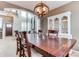 Formal dining room with statement lighting and updated cabinets for storage at 10882 Bullock Ct, Parker, CO 80134
