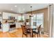 Cozy breakfast nook in updated kitchen with stainless steel appliances, and wood floors at 10882 Bullock Ct, Parker, CO 80134