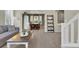 Open-concept living area leading to dining space with ample natural light and neutral decor at 10882 Bullock Ct, Parker, CO 80134
