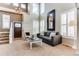 Bright living room with soaring ceilings, plantation shutters and neutral decor at 10882 Bullock Ct, Parker, CO 80134