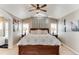 Spacious primary bedroom with vaulted ceilings, a ceiling fan, and natural light at 10882 Bullock Ct, Parker, CO 80134
