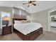 Cozy main bedroom with vaulted ceiling, large windows, and an ensuite bathroom at 10882 Bullock Ct, Parker, CO 80134