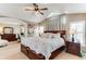 Spacious primary bedroom with vaulted ceilings, a ceiling fan, and an adjoining office at 10882 Bullock Ct, Parker, CO 80134