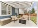 Cozy patio area with seating around a fire pit under a pergola, perfect for outdoor entertaining at 10882 Bullock Ct, Parker, CO 80134
