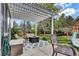 Relaxing outdoor space with a pergola, fire pit, and comfortable seating, perfect for entertaining at 10882 Bullock Ct, Parker, CO 80134
