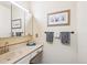 Clean and simple bathroom with a vanity, mirror, and neutral decor at 850 Idalia Cir, Aurora, CO 80011
