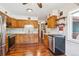 Traditional kitchen featuring wood cabinets, stainless steel appliances and hardwood floors at 850 Idalia Cir, Aurora, CO 80011
