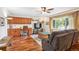 Cozy living room with hardwood floors and adjacent built-in desk with storage at 850 Idalia Cir, Aurora, CO 80011