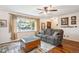 Comfortable living room featuring hardwood floors and a large window at 850 Idalia Cir, Aurora, CO 80011