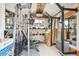 The interior of a storage shed, converted into a functional home gym with weights and gym equipment at 850 Idalia Cir, Aurora, CO 80011