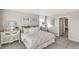 Bright bedroom with plush carpet, neutral walls, and a comfortable queen-sized bed at 1884 Westport Ave, Berthoud, CO 80513