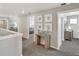 Hallway with neutral walls, leading to various rooms with elegant decor at 1884 Westport Ave, Berthoud, CO 80513