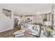 Open concept living room showing the kitchen, living, and dining areas, designed for entertaining at 1884 Westport Ave, Berthoud, CO 80513
