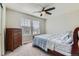 Comfortable bedroom featuring carpet flooring and natural light from two windows at 14067 Hudson St, Thornton, CO 80602