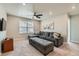 Comfortable living room with plush gray sofa and lots of natural light at 14067 Hudson St, Thornton, CO 80602