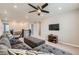 Spacious living room with a comfortable gray sectional and modern decor at 14067 Hudson St, Thornton, CO 80602