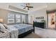 Bright main bedroom features tray ceiling, large windows and adjoins a ensuite bathroom at 14067 Hudson St, Thornton, CO 80602