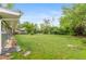 Spacious backyard with green lawn and mature trees offering a private outdoor space at 4405 Gardenia St, Golden, CO 80403