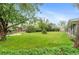 Expansive backyard with lush green grass, mature trees, and vibrant foliage creating a serene outdoor space at 4405 Gardenia St, Golden, CO 80403
