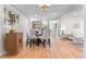 Bright dining area with hardwood floors, pendant lighting and seating for four, adjacent to the modern kitchen at 4405 Gardenia St, Golden, CO 80403