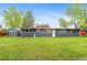 Charming single-story home with a well-kept lawn, complemented by a storage shed on the property at 4405 Gardenia St, Golden, CO 80403