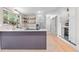 Modern kitchen with stainless steel appliances, eat-in island, sleek counters and open shelving at 4405 Gardenia St, Golden, CO 80403
